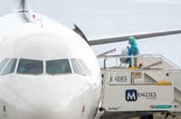 A BRITISH citizen boards a plane bound for the United Kingdom carrying passengers evacuated from the Dutch flagged hantavirus-stricken cruise ship MV Hondius at the Tenerife Sur-Reina Sofia airport on the island of Tenerife in Spain’s Canary Islands on 10 May 2026.