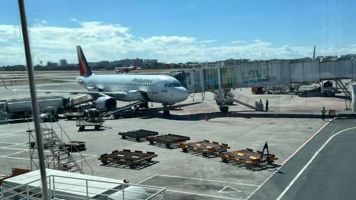 PAL airplane parked at NAIA Terminal 1