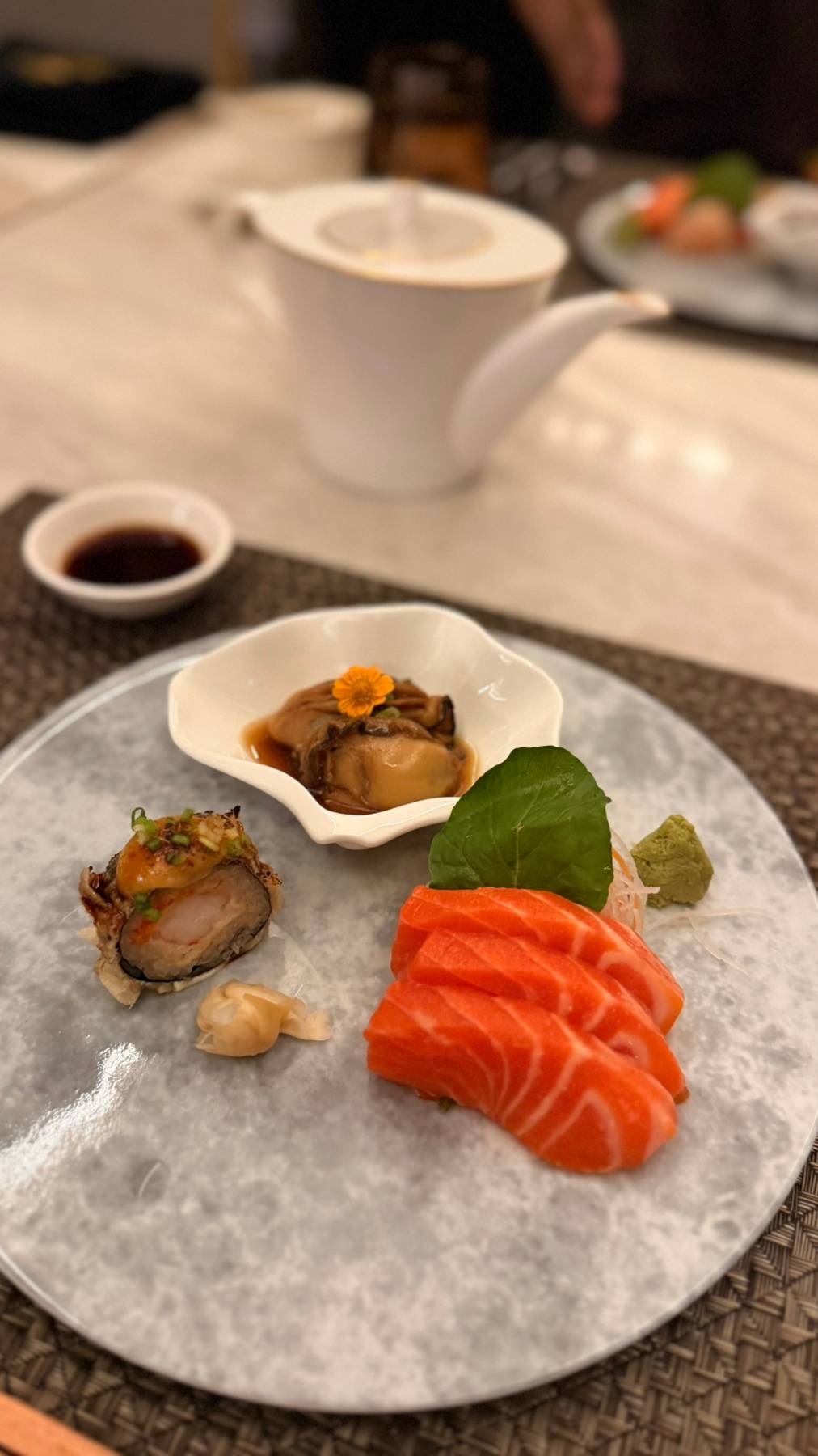 SIMMERED Japanese oyster, sustainable norwegian salmon sashimi and tempura miso maki.