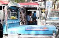 A jeepney driver patiently waits in line for passengers at a terminal in Quezon City. Public utility vehicle drivers are still reeling from the rising fuel costs the past weeks.