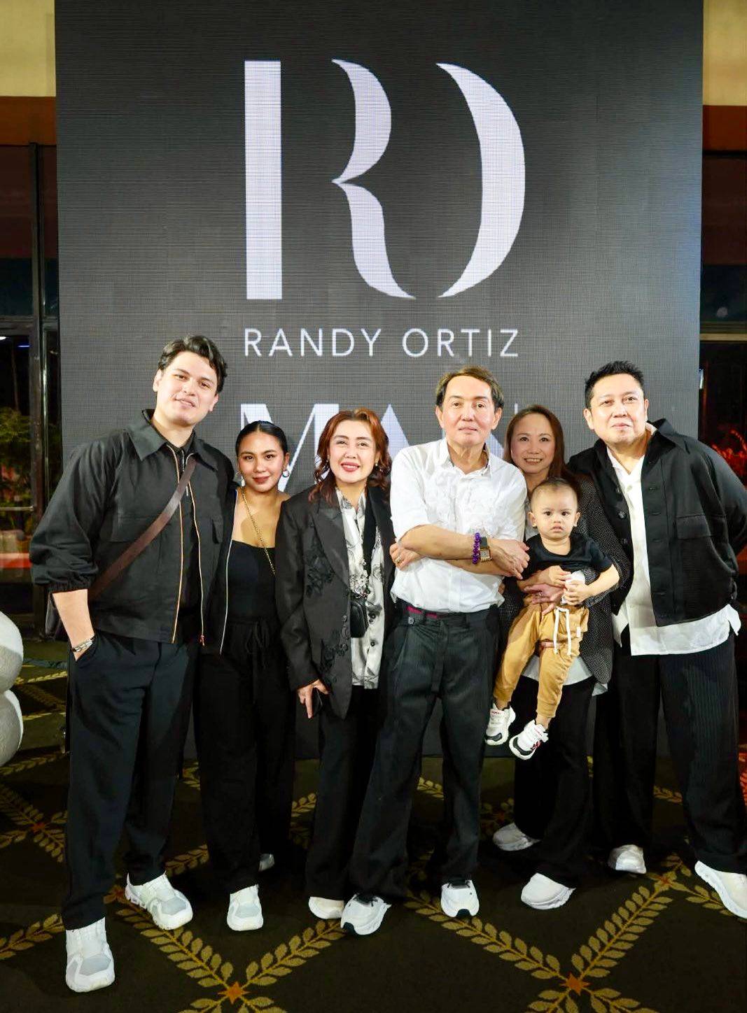 FASHION designer Randy Ortiz with his family.