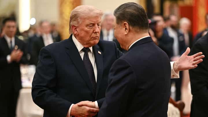 CHINA’S President Xi Jinping (right) and United States President Donald Trump shake hands as they attend a state banquet at the Great Hall of the People in Beijing on 14 May 2026.