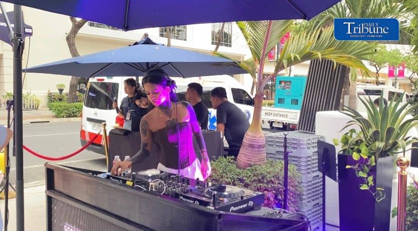 DJ playing upbeat tunes, keeping the crowd alive