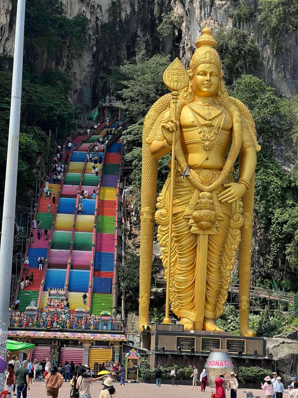 THE towering image of Lord Murugan in bronze and gold by the 272 steps to reach the cave.