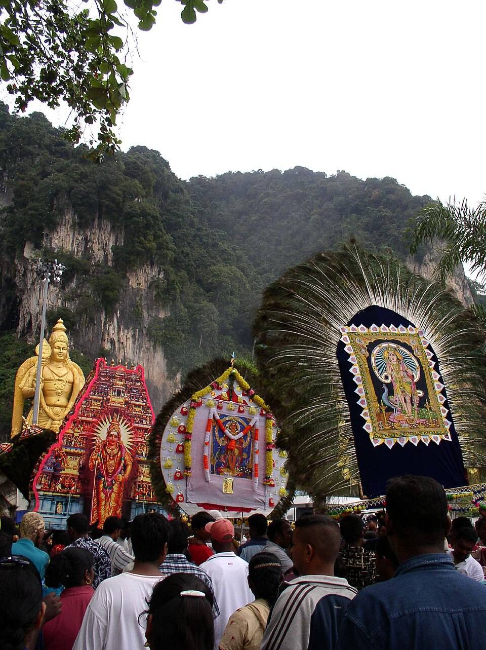 PROCESSION of Lord Murugan idols during a Thaipusam festival celebration.