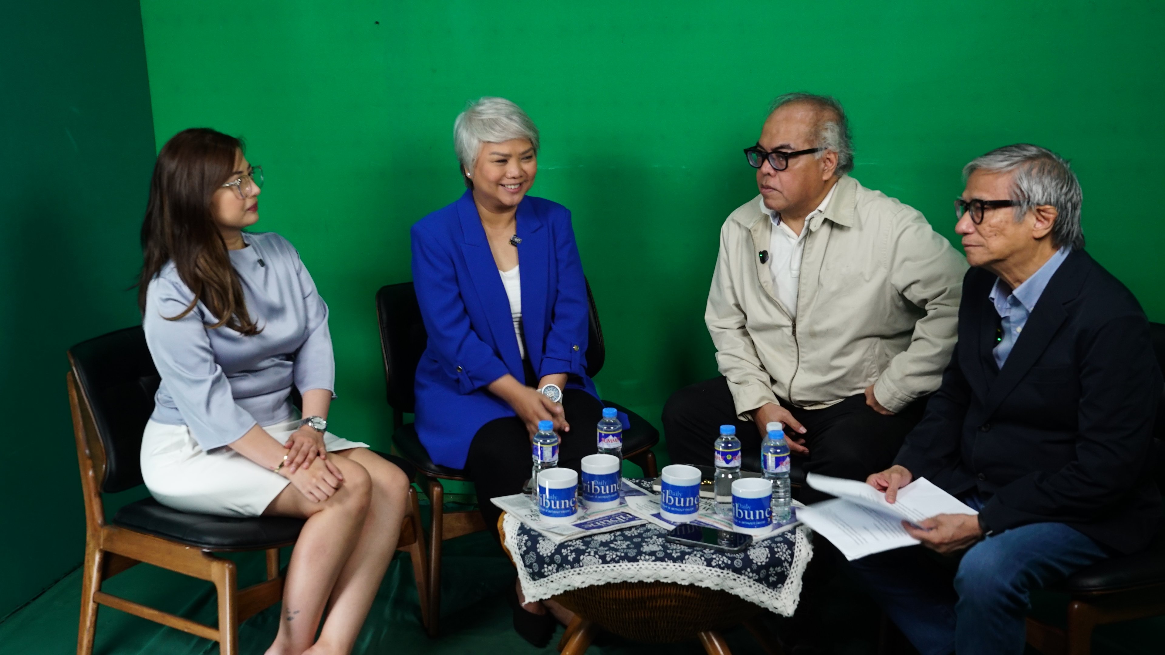 ONE in thirty-five SMFI external programs manager Anne Racoma (left) and manager for partnerships Joy Guevara (second from left) break down the numbers behind the foundation’s fiercely competitive college scholarship program for Straight Talk hosts Chito Lozada (third from left) and Teddy Montelibano — 35,000 applications, just 1,000 slots.