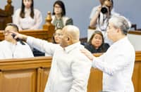 SENATOR Ronald dela Rosa is calmed by colleague Joel Villanueva amid a charged confrontation.
