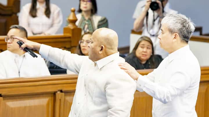 SENATOR Ronald dela Rosa is calmed by colleague Joel Villanueva amid a charged confrontation.