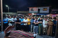 The lifeless body of ustadz Anwar Ebrahim being prayed by fellow Muslim before he was laid to rest..photo courtesy of Mindanao Sentinel