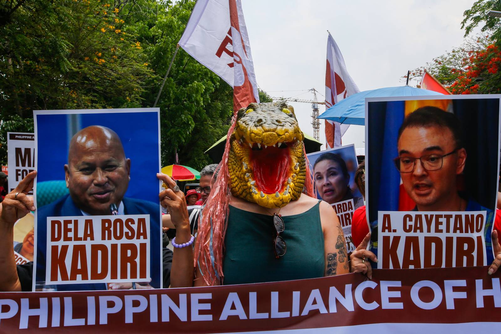 Human rights advocates march toward the Philippine Senate in Pasay City on 18 May 2026, as the chamber prepares to convene as an impeachment court against Vice President Sara Duterte. The protesters are demanding accountability for the escape of International Criminal Court fugitive Senator Ronald "Bato" Dela Rosa, who slipped away while under the Senate's protective custody.