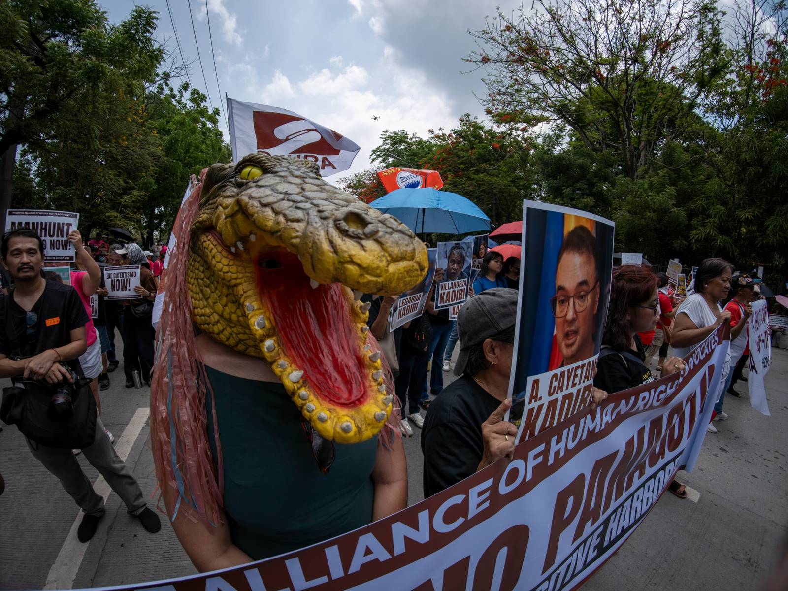 Human rights advocates march toward the Philippine Senate in Pasay City on 18 May 2026, as the chamber prepares to convene as an impeachment court against Vice President Sara Duterte. The protesters are demanding accountability for the escape of International Criminal Court fugitive Senator Ronald "Bato" Dela Rosa, who slipped away while under the Senate's protective custody.