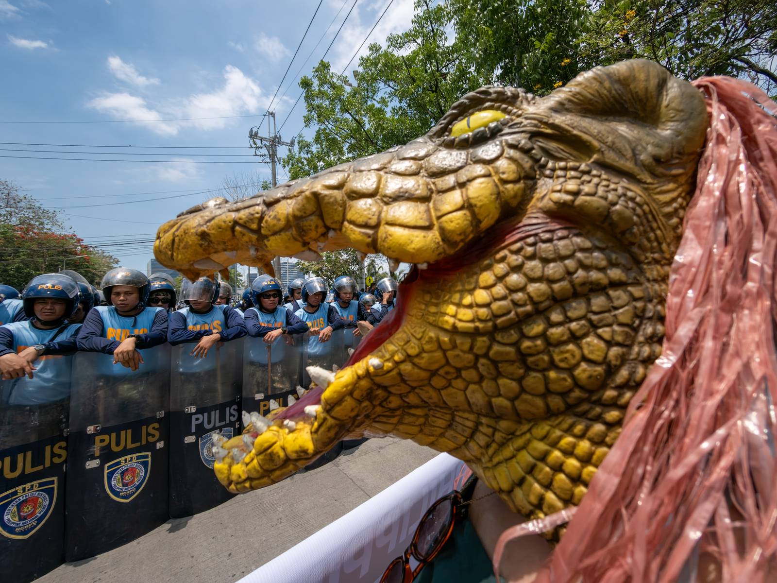 Human rights advocates march toward the Philippine Senate in Pasay City on 18 May 2026, as the chamber prepares to convene as an impeachment court against Vice President Sara Duterte. The protesters are demanding accountability for the escape of International Criminal Court fugitive Senator Ronald "Bato" Dela Rosa, who slipped away while under the Senate's protective custody.