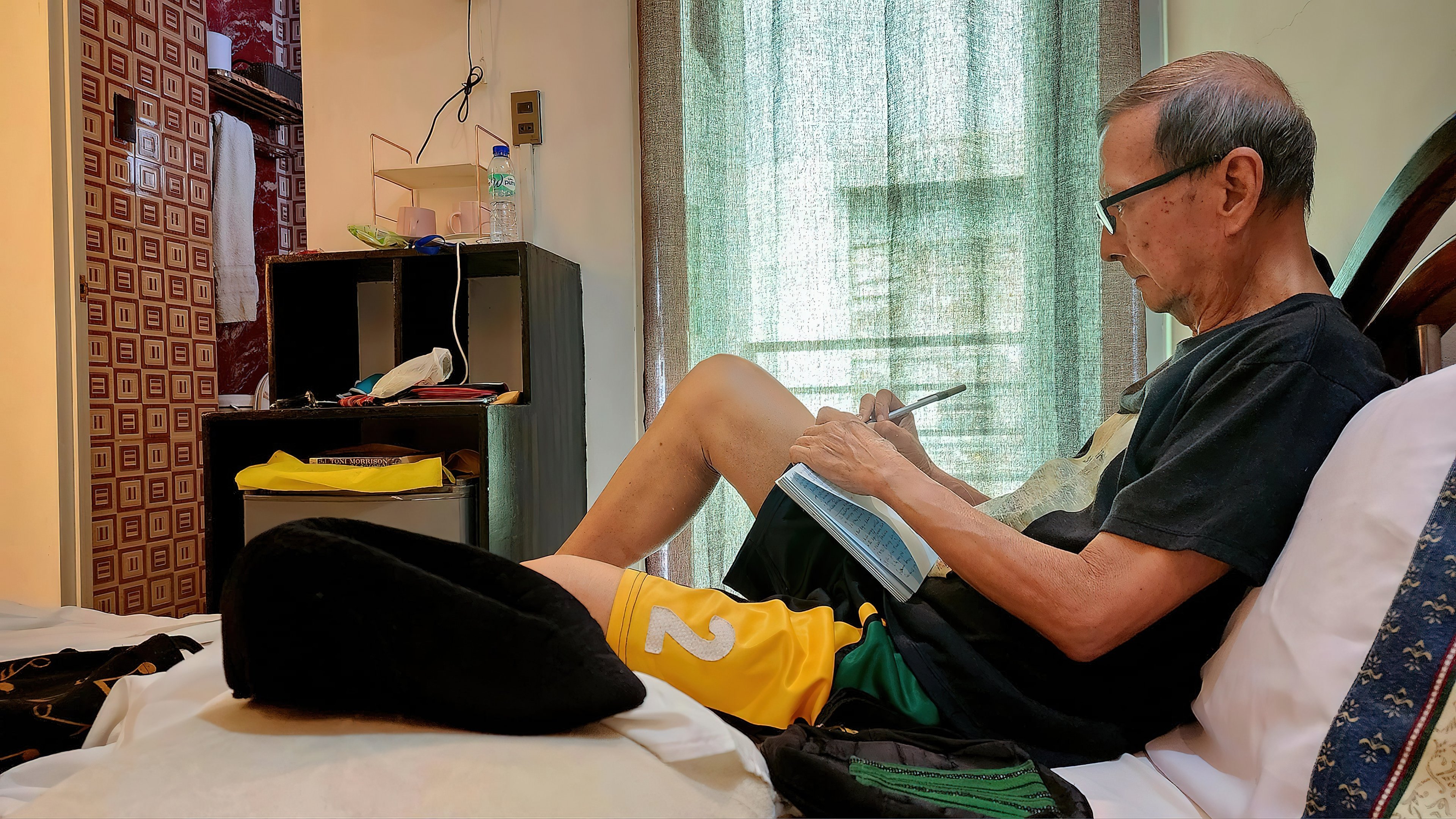 GUERRERO writing an article in Ilagan, Isabela, in May 2024.