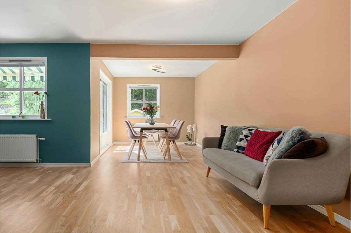 WARM neutrals paired with calming teal accents create a cozy yet refreshing atmosphere.