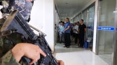 OPERATIONAL elements of the Presidential Anti-Organized Crime Commission and the Department of National Defense secure the Philippine Veterans Investment Development Corporation Industrial Authority compound in Tagoloan, Misamis Oriental.