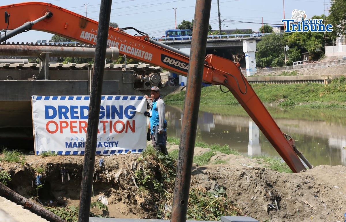 Heavy equipment from the Marikina local government conducts dredging and widening operations along the Marikina River on Tuesday, 20 May 2026, as part of flood mitigation efforts and to maintain the river’s capacity to handle large volumes of water during heavy rains.