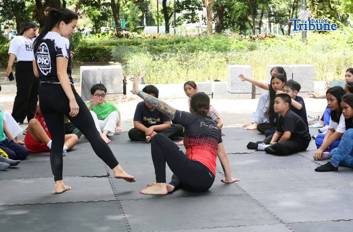 (May 23 2026) Professor Ayjell De Castro and Professor Alex Lee teach Jiu Jitsu basic self-defence skills to kids ages 10 to 15, at Quezon City Circle on Saturday May 23 2026, a free summer workshop conducted by Quezon City Government. Photo/Analy Labor
