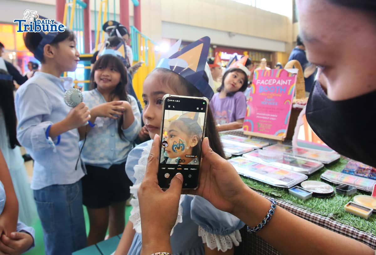 (May 23 2026)  Kids enjoy playing, hugging the Bluey and Bingo mascots and the face paint, during the launching of Bluey Playdates with Friends at SM Marikina on Saturday May 23 2026, highlighted by a ribbon cutting ceremony and fun meet & greet photo opportunities with Bluey and Bingo mascots. The interactive garden-inspired play area lets families enjoy immersive photo spots and playful moments at the mall atrium as part of the Project: Playverse of SM Supermalls. Photo/Analy Labor