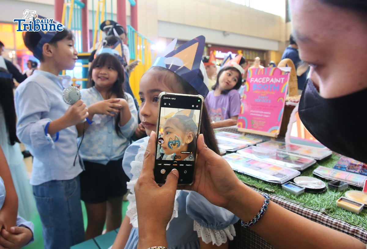 (May 23 2026) Kids enjoy playing, hugging the Bluey and Bingo mascots and the face paint, during the launching of Bluey Playdates with Friends at SM Marikina on Saturday May 23 2026, highlighted by a ribbon cutting ceremony and fun meet & greet photo opportunities with Bluey and Bingo mascots. The interactive garden-inspired play area lets families enjoy immersive photo spots and playful moments at the mall atrium as part of the Project: Playverse of SM Supermalls. Photo/Analy Labor