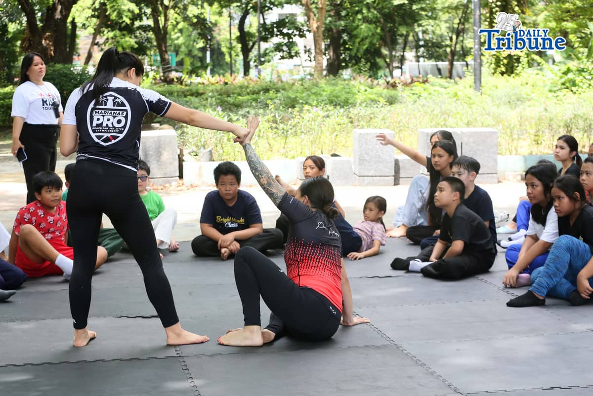 (May 23 2026) Professor Ayjell De Castro and Professor Alex Lee teach Jiu Jitsu basic self-defence skills to kids ages 10 to 15, at Quezon City Circle on Saturday May 23 2026, a free summer workshop conducted by Quezon City Government. Photo/Analy Labor