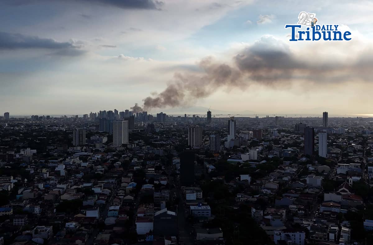 (May 23 2026) Smoke from the fire at Delpan Binondo Manila, that reached up to task force Bravo was seen from Quezon City, on Saturday May 23 2026. Photo/Analy Labor