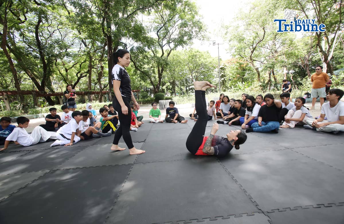 (May 23 2026) Professor Ayjell De Castro and Professor Alex Lee teach Jiu Jitsu basic self-defence skills to kids ages 10 to 15, at Quezon City Circle on Saturday May 23 2026, a free summer workshop conducted by Quezon City Government. Photo/Analy Labor
