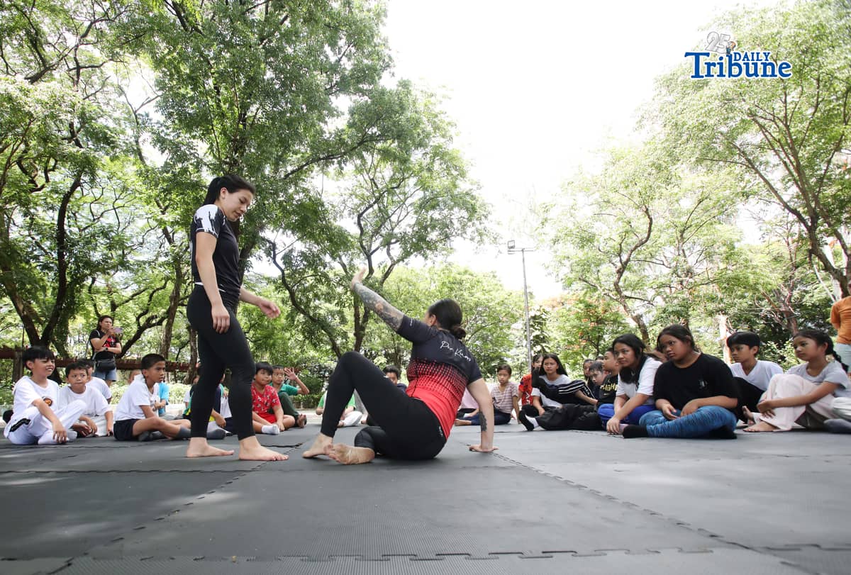 (May 23 2026) Professor Ayjell De Castro and Professor Alex Lee teach Jiu Jitsu basic self-defence skills to kids ages 10 to 15, at Quezon City Circle on Saturday May 23 2026, a free summer workshop conducted by Quezon City Government. Photo/Analy Labor