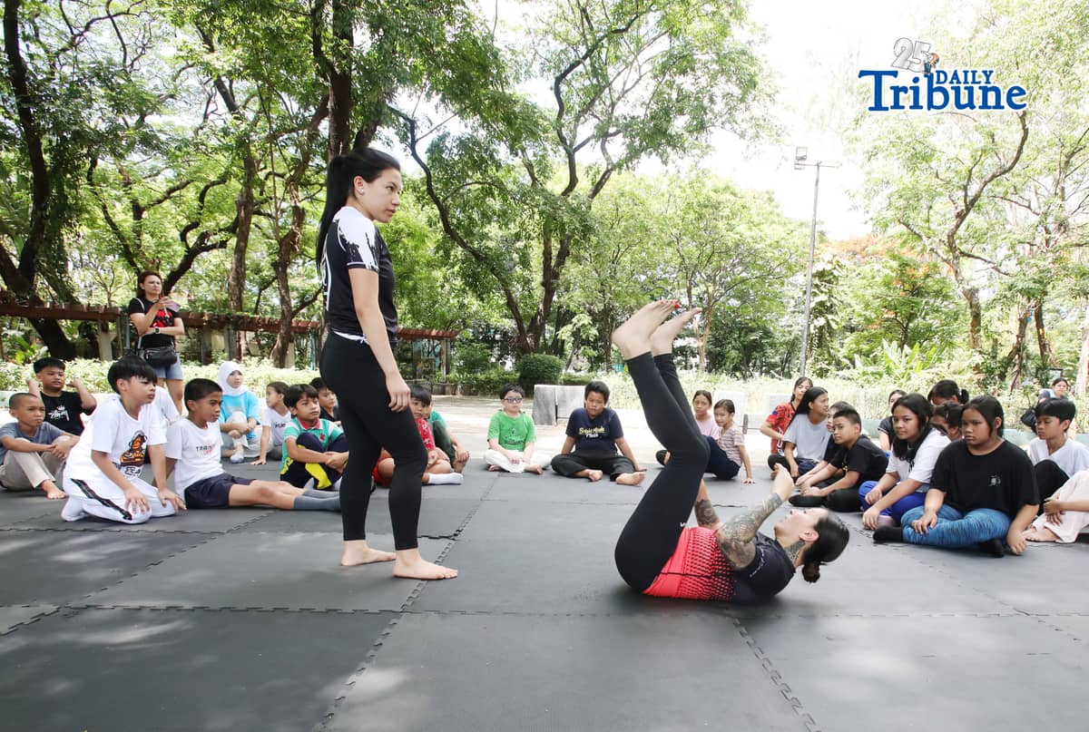 (May 23 2026) Professor Ayjell De Castro and Professor Alex Lee teach Jiu Jitsu basic self-defence skills to kids ages 10 to 15, at Quezon City Circle on Saturday May 23 2026, a free summer workshop conducted by Quezon City Government. Photo/Analy Labor