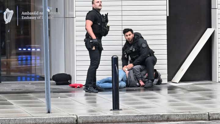 WHITE House chaos Secret Service agents assist a wounded man after a shooting near the White House in Washington, D.C., on Saturday. The gunman was killed.