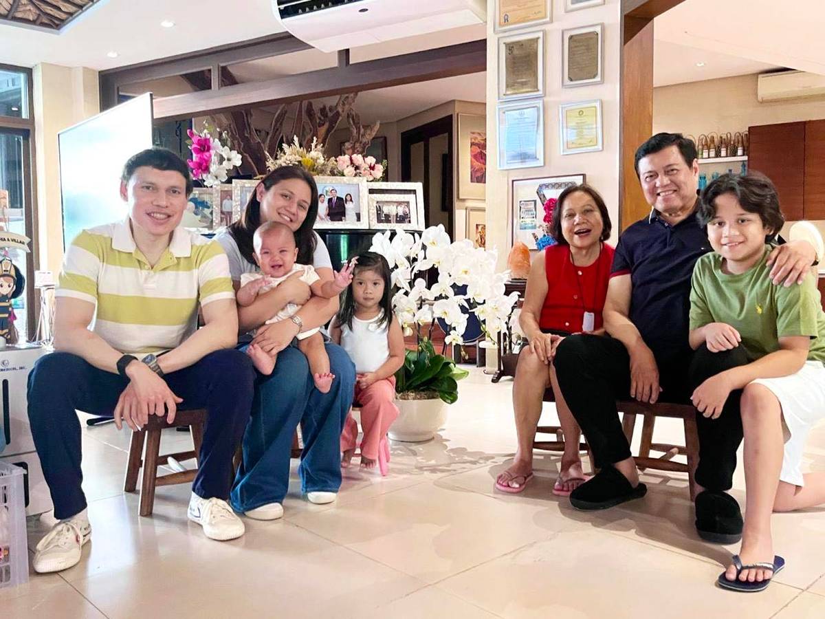 MANNY Villar shares a warm moment as a family man during a Mother’s Day gathering, with (from left) Paolo Villar, Senator Camille Villar holding baby Camille Claudia, Cara, former Senator Cynthia Villar, Manny and Tristan Villar-Genuino.