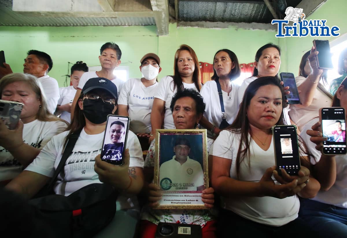 (May 25 2026) Relatives of the missing “sabungeros”  shows a photo of their relatives and speak at the press conference held at Hagonoy Bulacan on Monday May 25 2026, to denied the allegation that they had abandoned the case, they said that they were not required to attend the hearing unless they were specifically called upon. They also cited the financial burden of transportation costs, noting that complainants from Bulacan would have to travel to Laguna for the hearing. Photo/Analy Labor