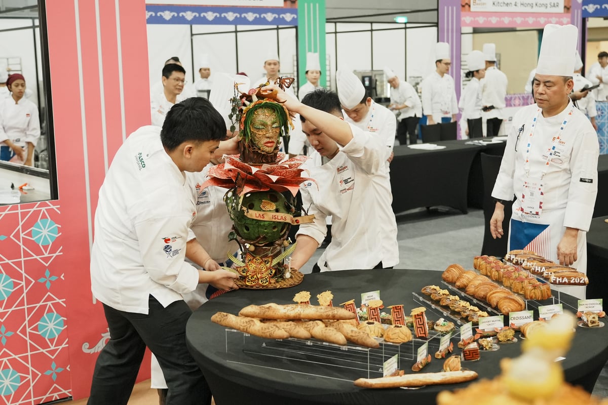 THE winning Philippine team putting the centerpiece on their bread and pastry display.