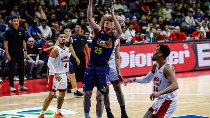 SANTI Santillan of Rain or Shine gets fouled by a Barangay Ginebra defender during Game 4 of their PBA Season 50 Commissioner’s Cup best-of-seven semifinal series on Wednesday.