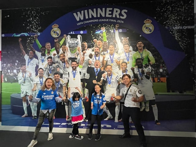 BERNARDOS at the Bernabéu The author and her family wearing personalized official Real Madrid jerseys at the football club’s stadium.