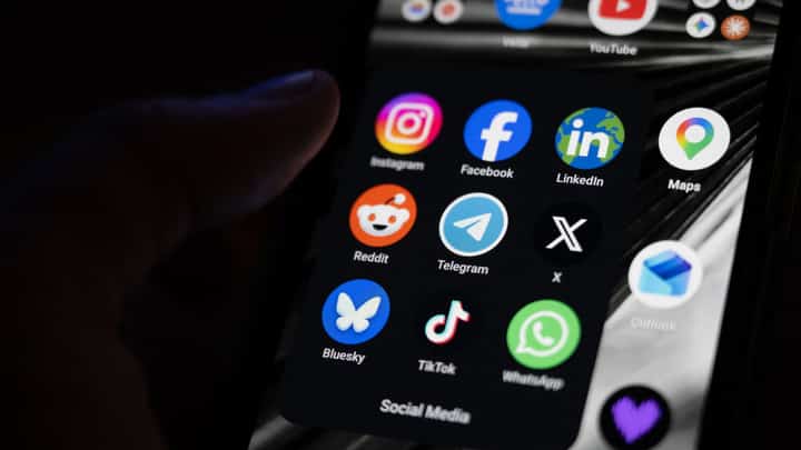 This photograph shows a set up smart-phone screen displaying the logo of main social media platforms including Instagram, Facebook, LinkedIn, Reddit, Telegram, X, Bluesky, Tiktok and Whatsapp in Saint-Mande, east of Paris, on April 29, 2026.