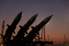 Iran and U.S. trade air strikes after Trump dismisses report of Hormuz deal