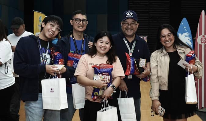 PARTICIPANTS exploring the booths and collecting freebies at the event
