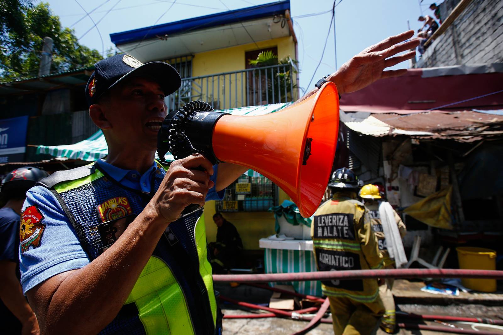 Firefighters and residents work together to control a raging third-alarm fire at the Baseco Compound in Port Area, Manila, on 30 May 2026. The incident comes just a week after a separate blaze gutted a nearby coastal community across the Pasig River.