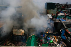 Third-alarm fire hits Baseco Compound in Manila