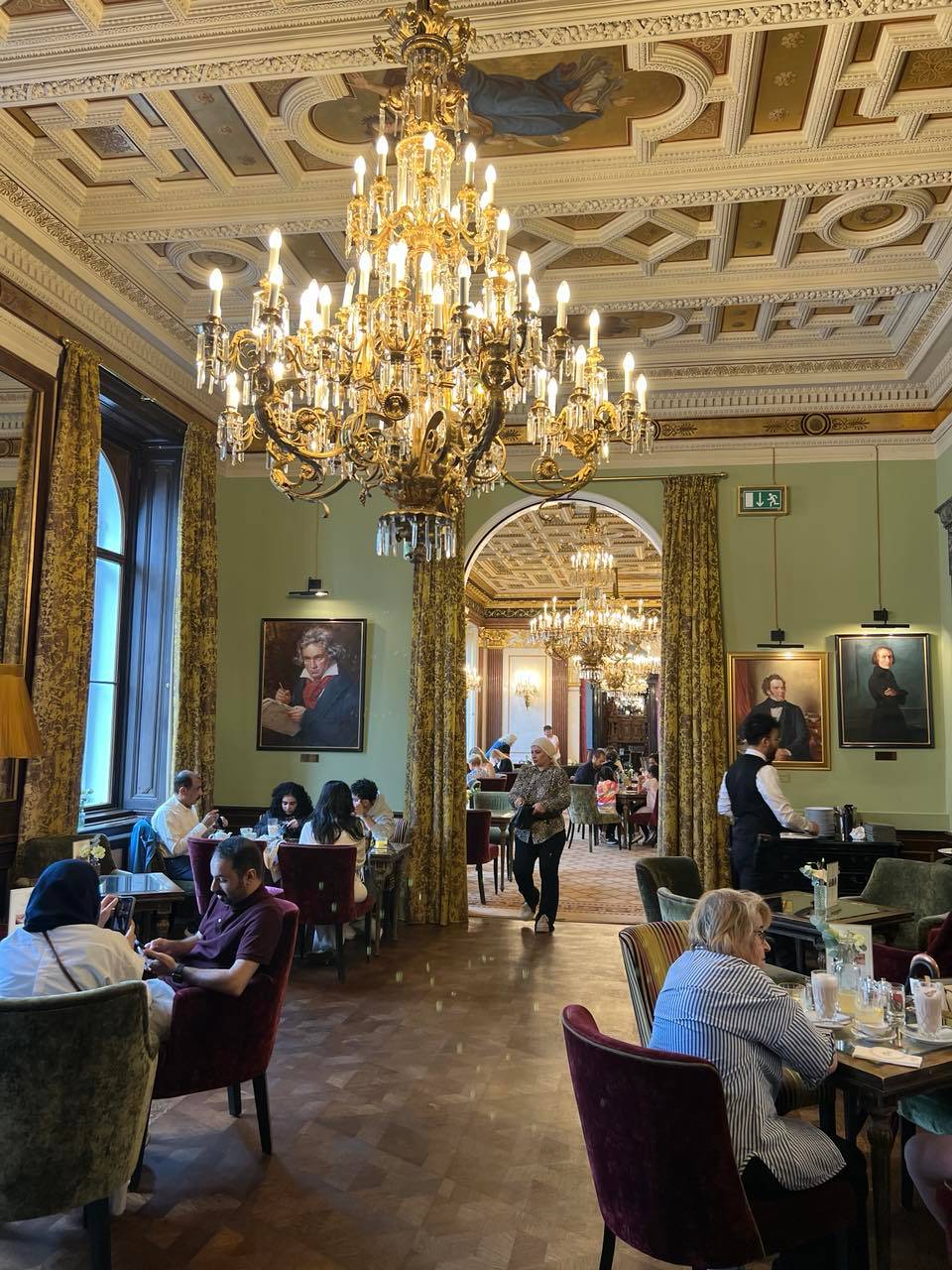 THE busy dining hall adorned with portraits of famous artists.