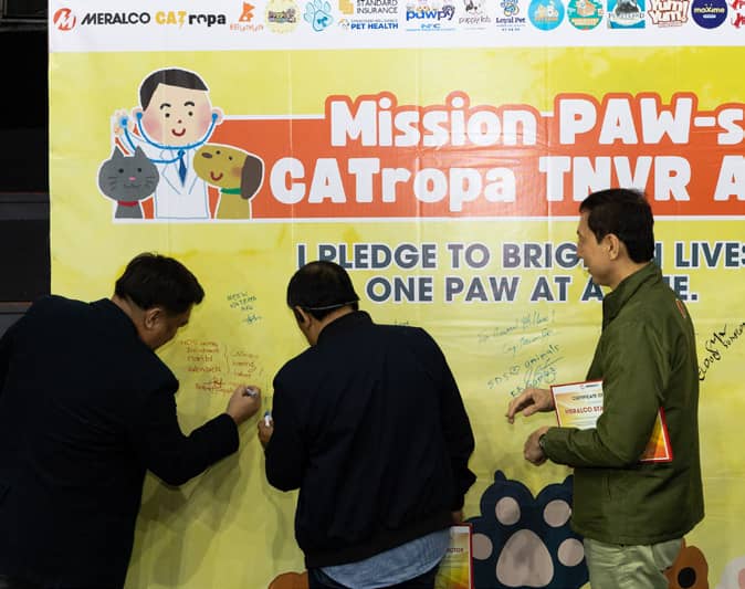 MERALCO sector heads sign the CATropa Pledge Wall, affirming their shared commitment to uphold animal welfare and promote a culture of malasakit across their respective areas.