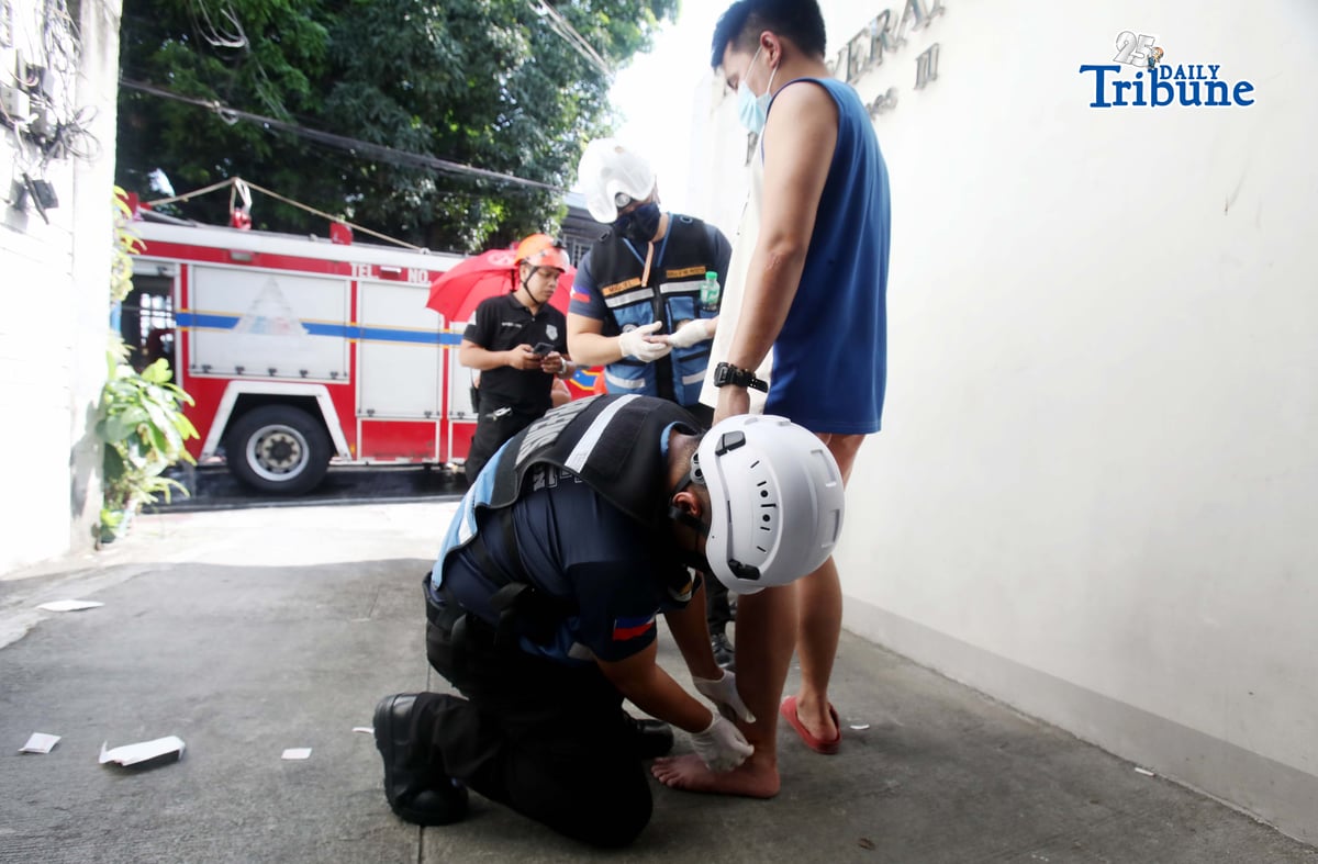 (May 30 2026)  Bureau of Fire Protection, Emergency Medical Services (BFP- EMS). Personnel providing first aid to the  first degree burn to  the one of the injured from the first alarm fire at Maningning corner Maamo street in Quezon City, on Saturday  May 30 2026. Photo/Analy Labor