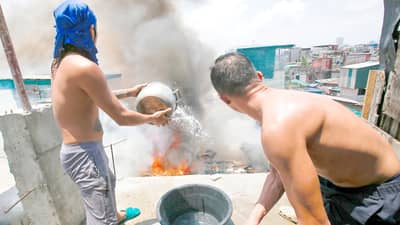 FIREFIGHTERS and residents join forces to contain a third-alarm fire at the Baseco Compound in Manila’s Port Area on Saturday, just days after another blaze struck a nearby riverside community.