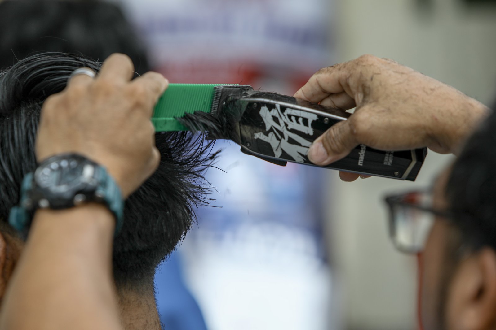 Members of the Triskelion Grand Fraternity jumpstarted a back-to-school free haircut outreach program at Kamias Extension, Quezon City on Sunday, 31 May, 2026. Thirty community students for the upcoming school year have been provided with haircuts along the community covered court.| Aram Lascano