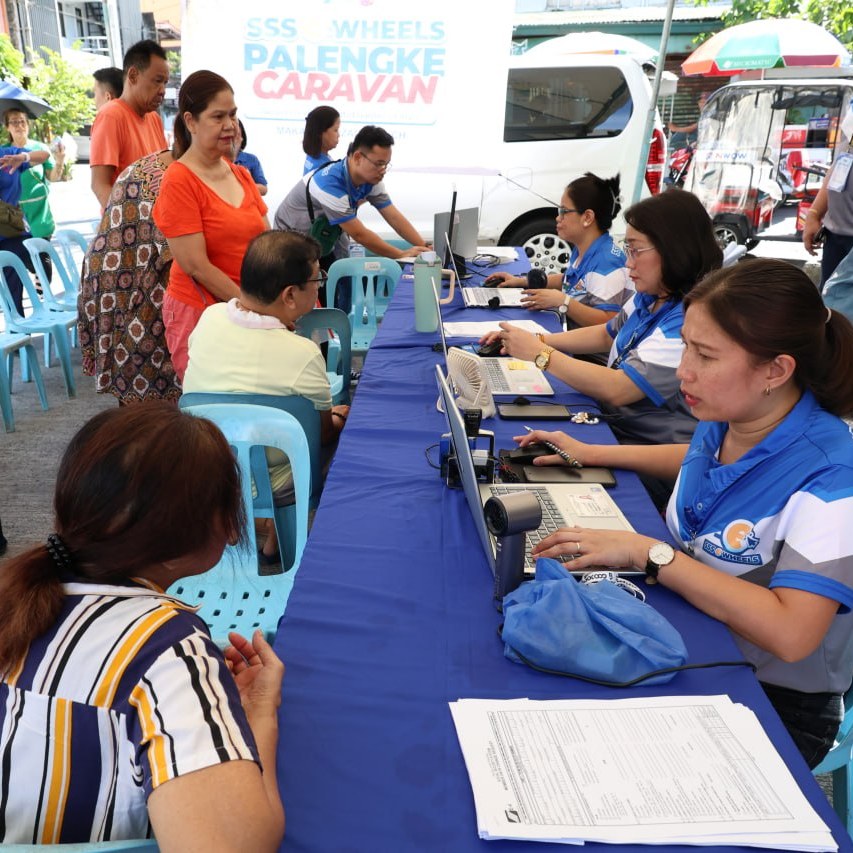 WORKERS from the local government provide aid to beneficiaries through the city’s Palengke Caravan program.