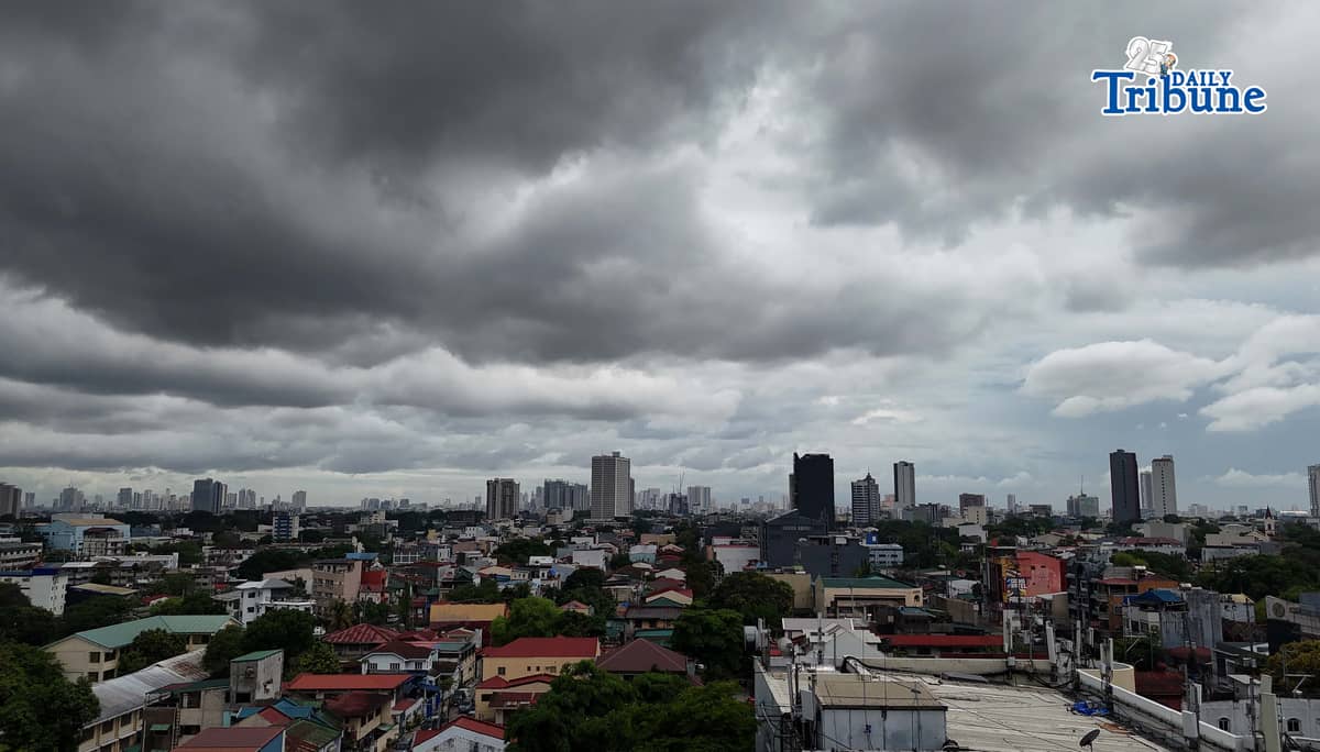 Dark clouds loom over Metro Manila and nearby provinces on Monday as Typhoon Domeng (Jangmi) continues to enhance the southwest monsoon, bringing rains to parts of the country. PAGASA said the storm may exit the Philippine Area of Responsibility by Monday night. | Photo by Analy Labor
