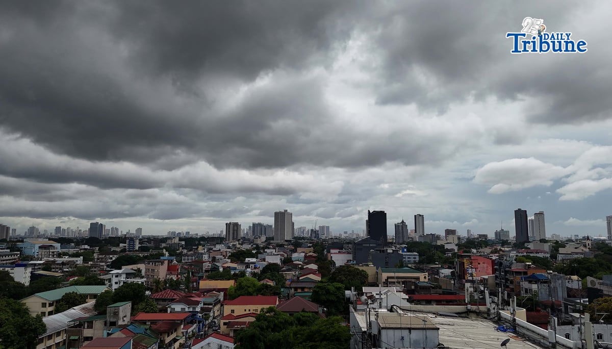 Dark clouds loom over Metro Manila and nearby provinces on Monday as Typhoon Domeng (Jangmi) continues to enhance the southwest monsoon, bringing rains to parts of the country. PAGASA said the storm may exit the Philippine Area of Responsibility by Monday night. | Photo by Analy Labor