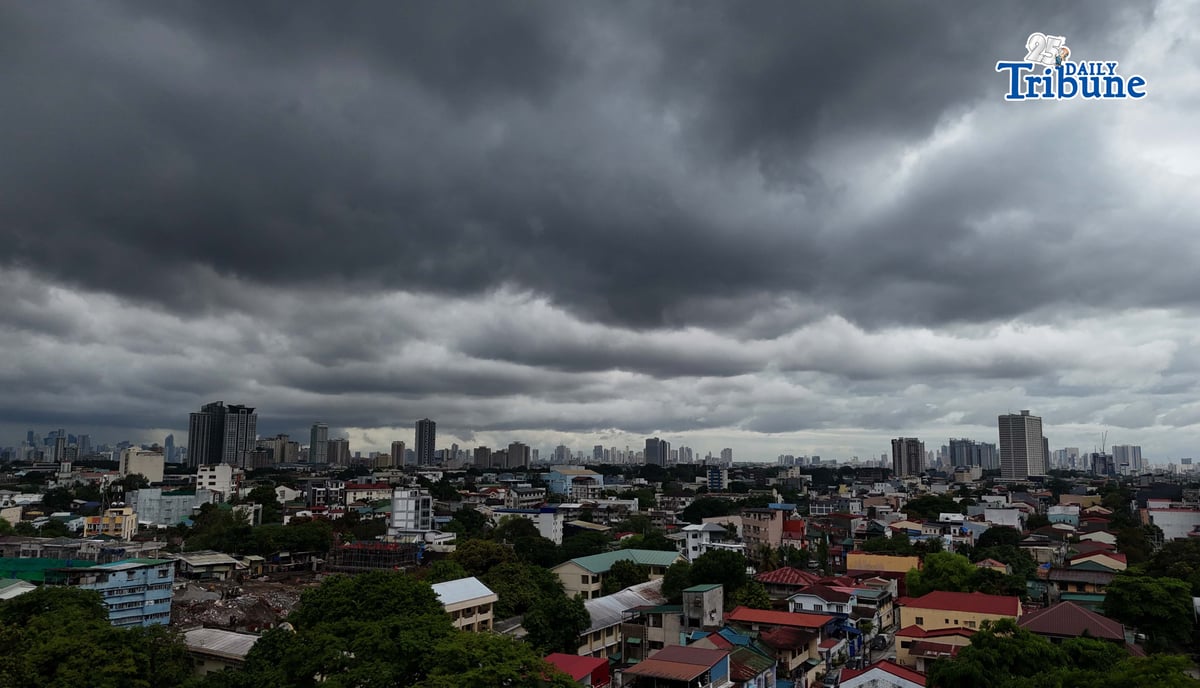 Dark clouds loom over Metro Manila and nearby provinces on Monday as Typhoon Domeng (Jangmi) continues to enhance the southwest monsoon, bringing rains to parts of the country. PAGASA said the storm may exit the Philippine Area of Responsibility by Monday night. | Photo by Analy Labor