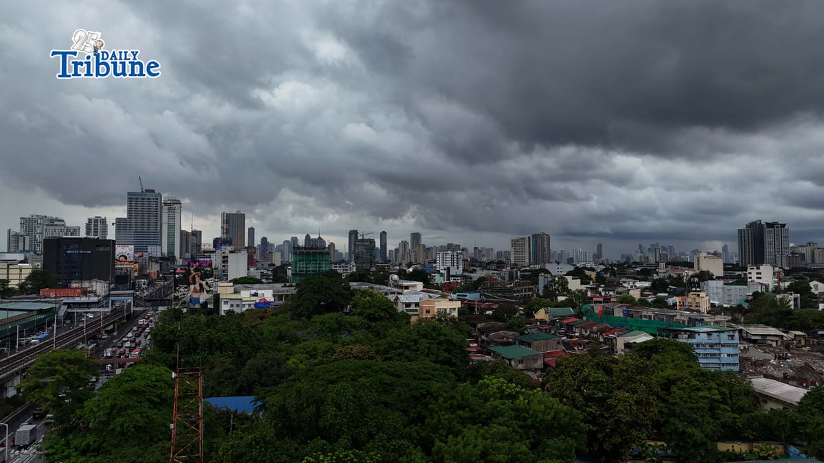 Dark clouds loom over Metro Manila and nearby provinces on Monday as Typhoon Domeng (Jangmi) continues to enhance the southwest monsoon, bringing rains to parts of the country. PAGASA said the storm may exit the Philippine Area of Responsibility by Monday night. | Photo by Analy Labor