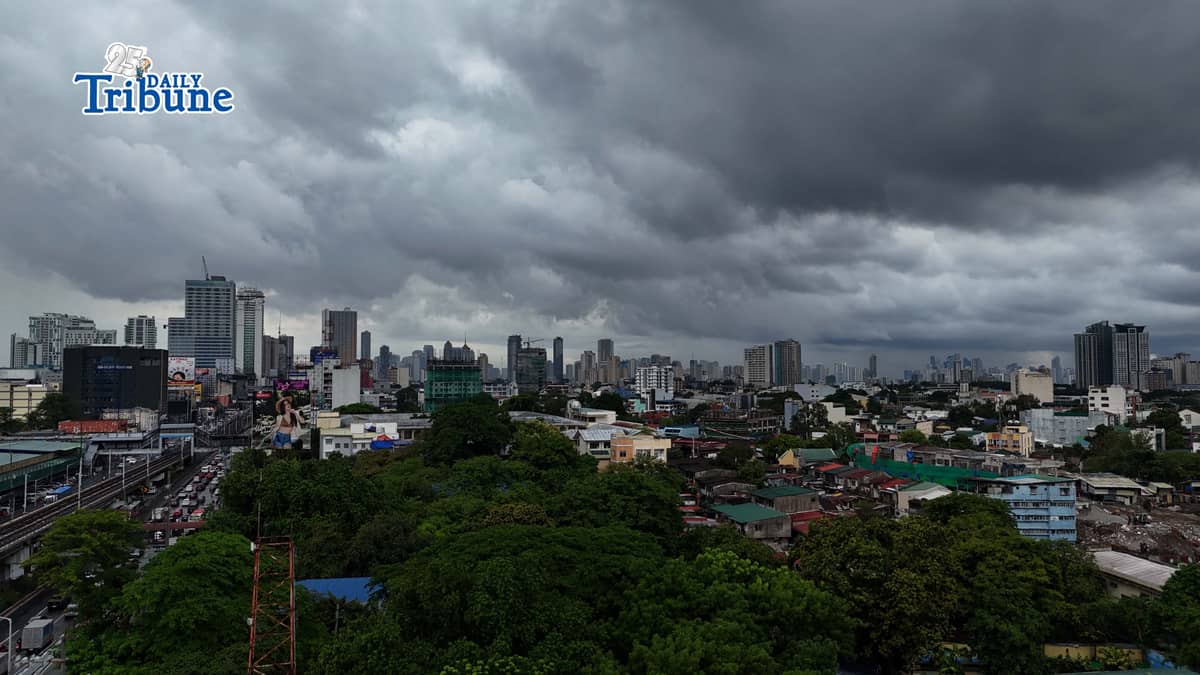 Dark clouds loom over Metro Manila and nearby provinces on Monday as Typhoon Domeng (Jangmi) continues to enhance the southwest monsoon, bringing rains to parts of the country. PAGASA said the storm may exit the Philippine Area of Responsibility by Monday night. | Photo by Analy Labor